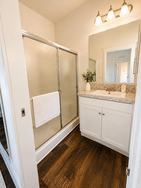 Primary bathroom shower and vanity